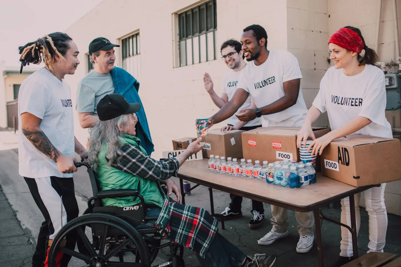 Community volunteers sharing essential supplies